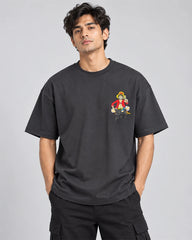 Model wearing a charcoal Luffy oversized T-shirt with baggy streetwear jeans