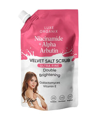 Luxe Organix Niacinamide and Alpha Arbutin Velvet Salt Body Scrub 300g pink pouch front view for brightening and exfoliating body care