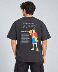 Back view of model wearing One Piece Luffy oversized T-shirt with large graphic