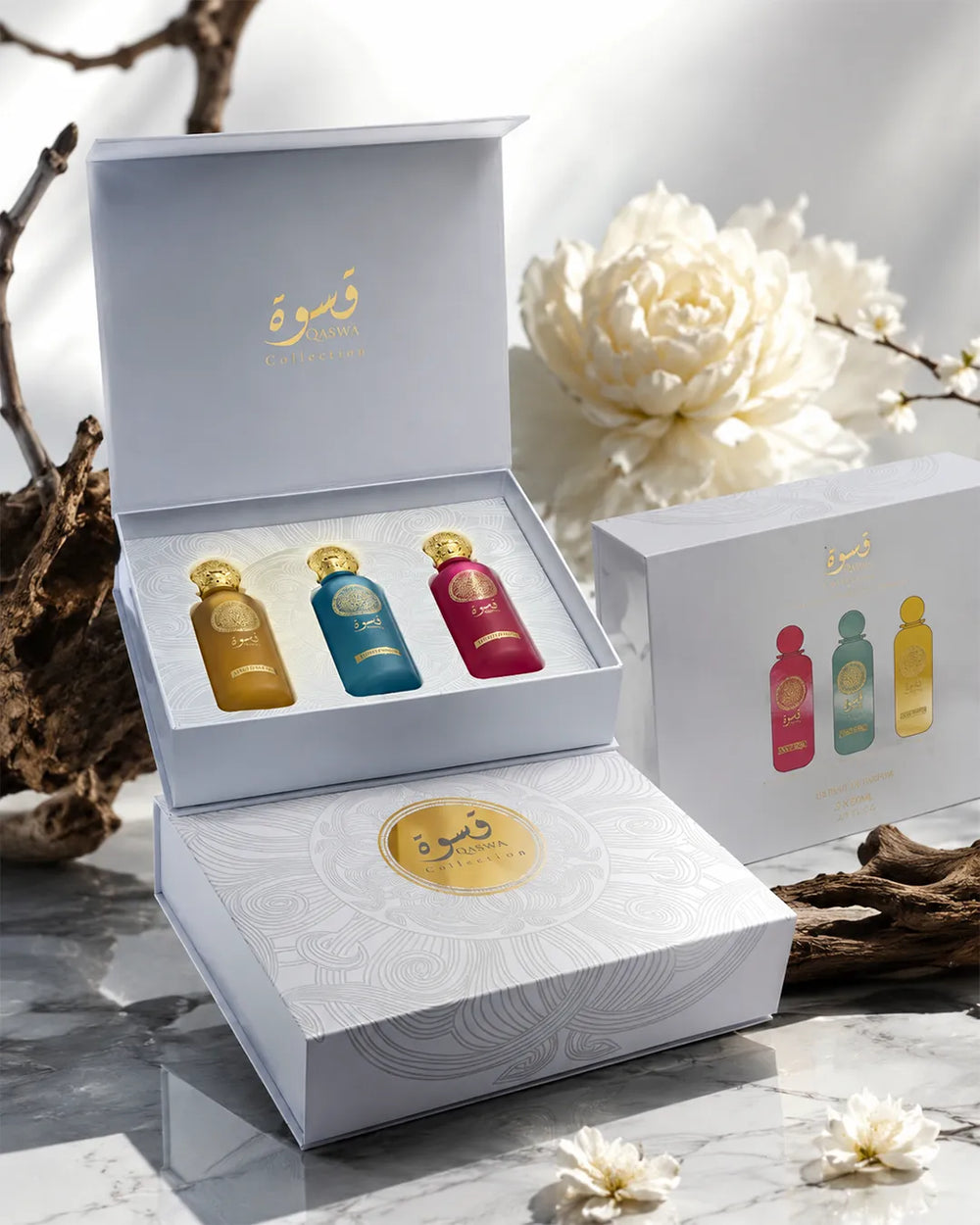 Qaswa Collection luxury perfume gift set with three elegant unisex fragrance bottles and premium box