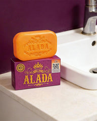 ALADA Instant Whitening Soap 160g displayed beside a bathroom sink in a skincare lifestyle setting