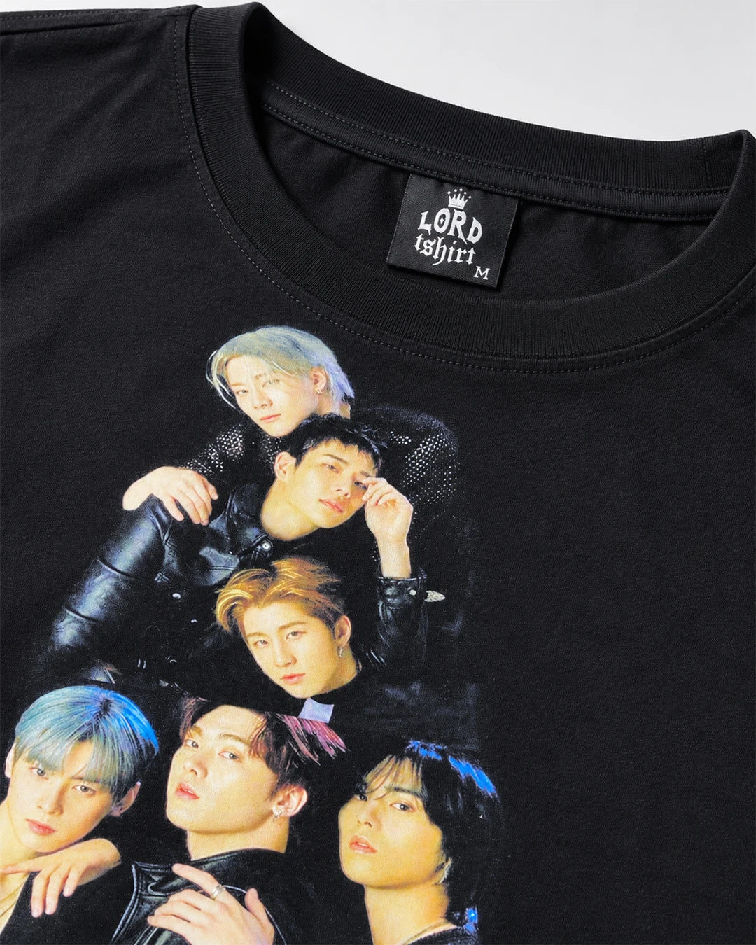 Close-up of ASTRO group photo graphic print on black T-shirt