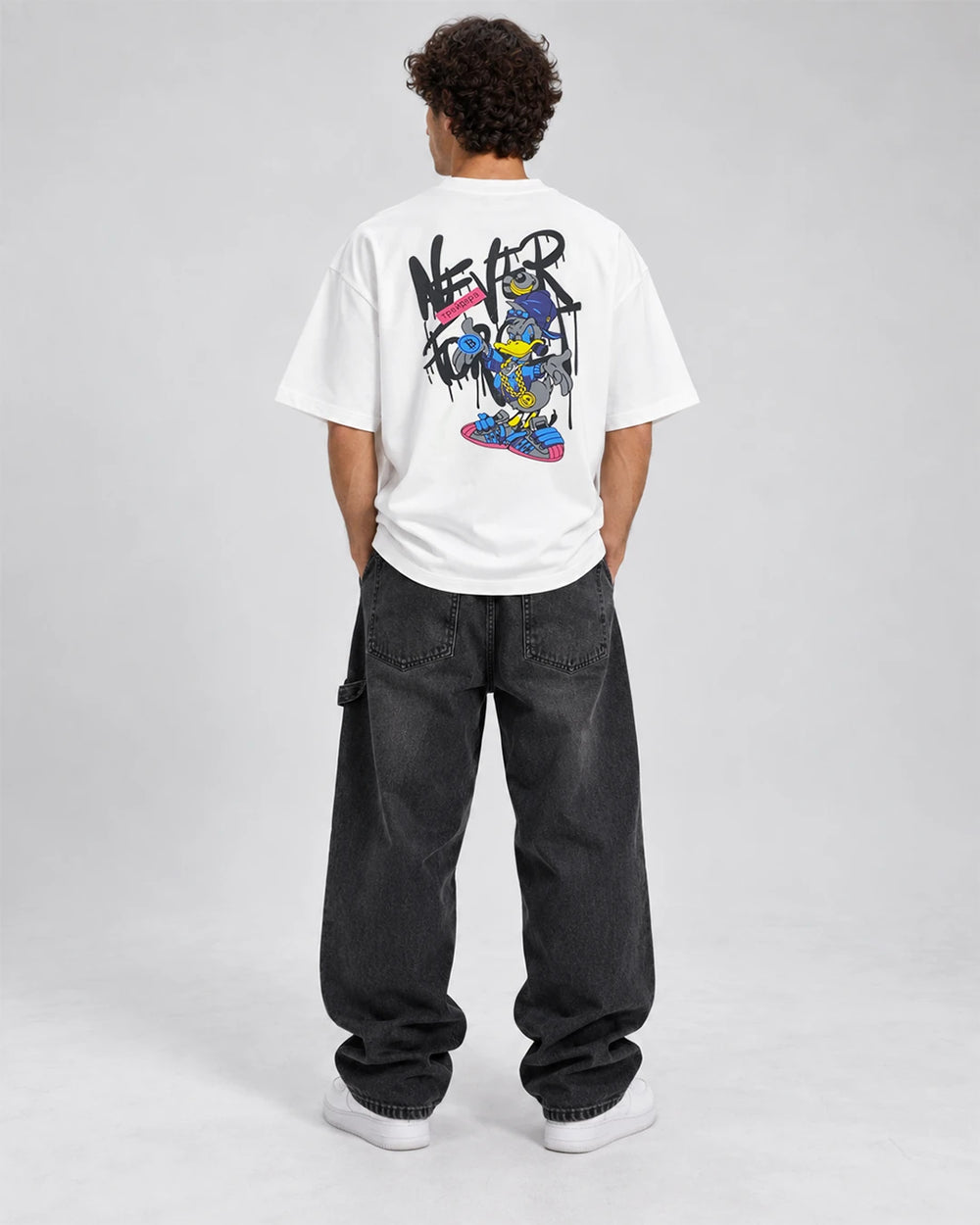Back view of model wearing duck oversized T-shirt with large streetwear graphic