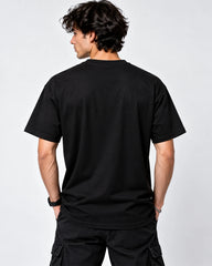 Model wearing Hellfire Club black T-shirt showing the plain black back