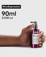 L'Oréal Professionnel Curl Expression Density Stimulator 90ml shown in hand with product size highlighted