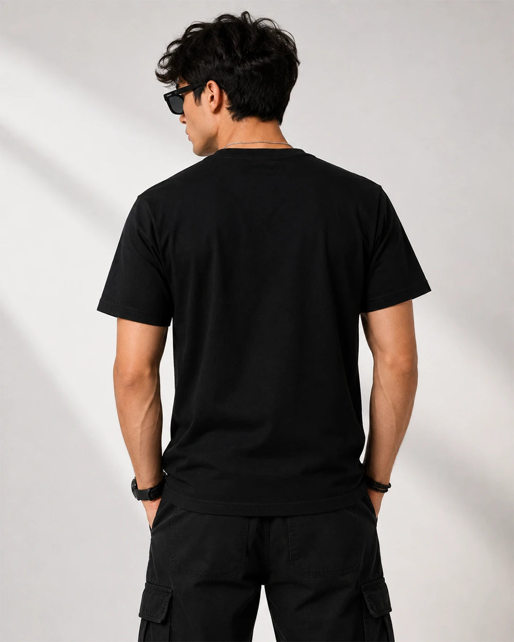 Model wearing One Piece Luffy Moon black T-shirt showing the plain back