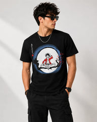 Model wearing One Piece Luffy Moon black graphic T-shirt, front view