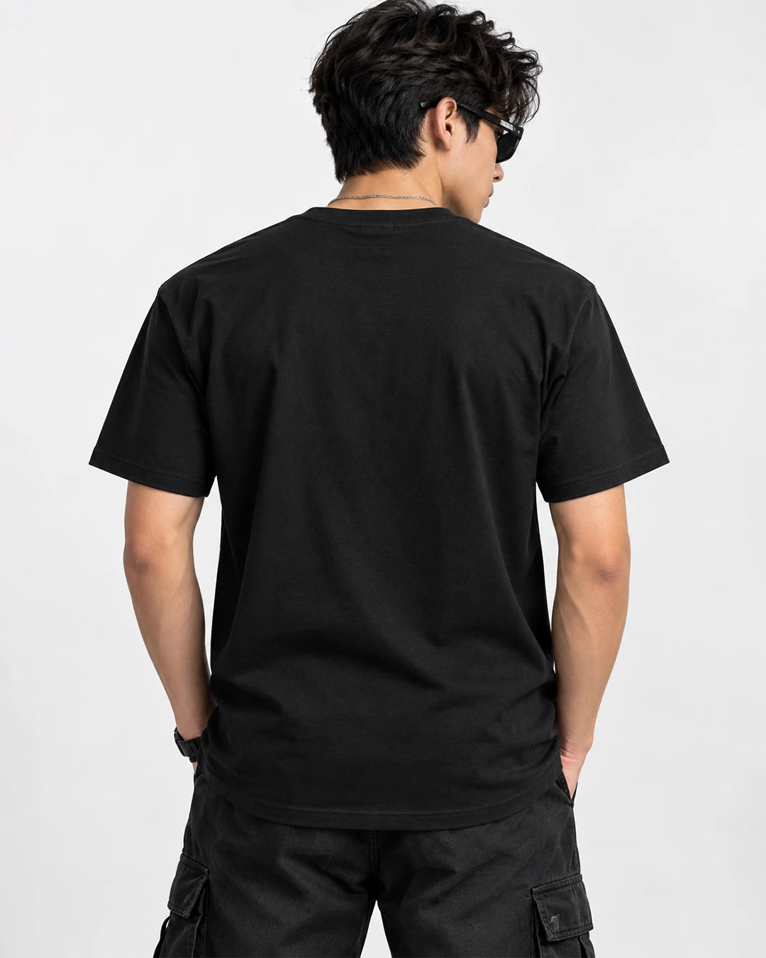 Model wearing Rick and Morty black T-shirt showing the plain black back