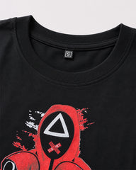 Close-up of Squid Game masked guards and geometric symbols graphic print on black T-shirt